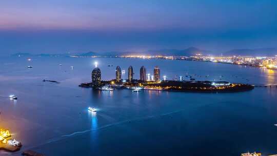 中国海南三亚三亚湾凤凰岛夜景延时摄影