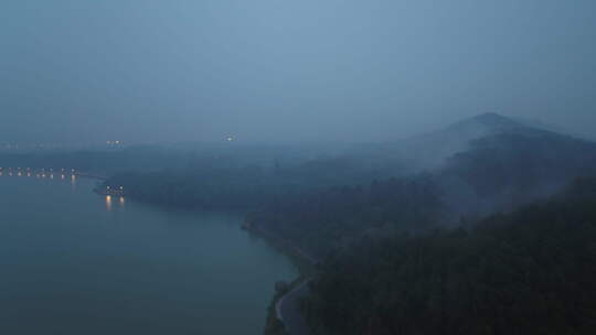 航拍武汉东湖磨山清晨雾气山丘