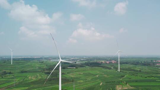 航拍农田绿色能源风力发电机