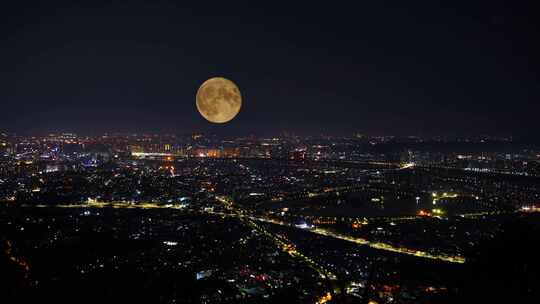 中秋节夜晚城市月亮升起延时城市夜景风光