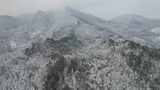 连绵起伏山川丘陵森林冬天雪景航拍高清在线视频素材下载