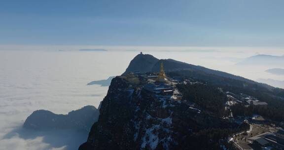 航拍晴朗天空下峨眉山金顶云海风景