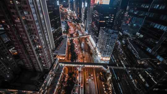 航拍城市高楼夜景下的车流交通