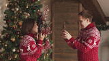 圣诞节丈夫为妻子拍摄高清在线视频素材下载