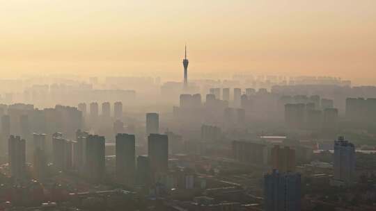 中国河南郑州清晨日出晨雾城市风光航拍