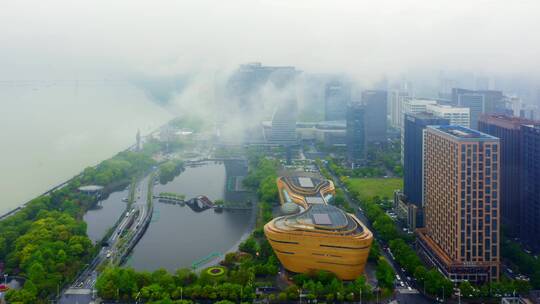 雾中杭州滨江城区现代地标建筑航拍