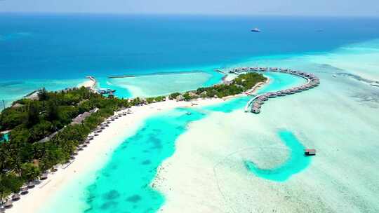 航拍海边度假屋海岛度假酒店沙滩马尔代夫视频素材模板下载
