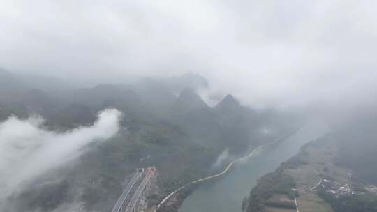 航拍云雾缭绕的广东清远连江畔高速公路