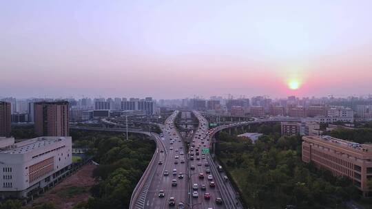 航拍夕阳下杭州城区高架立交桥