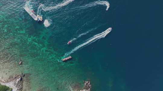 航拍三亚蜈支洲岛海浪碧绿海水礁石游艇沙滩