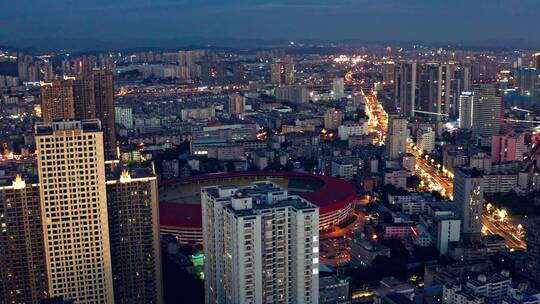 汇都国际楼顶航拍华灯初上时的昆明城市风光视频素材模板下载