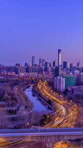 冬季北京国贸城市天际线与车流夜转日延时
