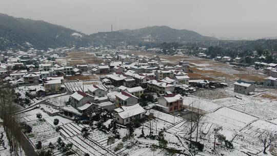 航拍美丽乡村田园冬天雪景