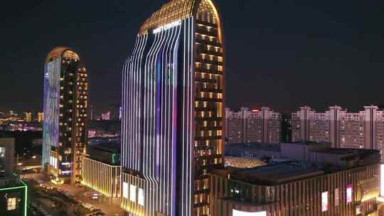 航拍扬州京华城商圈五彩世界大楼夜景灯光视频素材模板下载