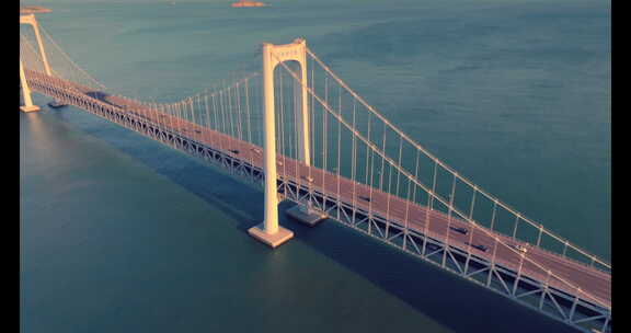 大连航拍海边跨海湾大桥唯美岩壁大海夕阳