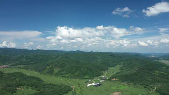 航拍中国东北长白山云朵与农田山川