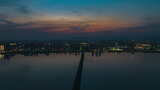 日落火烧云下的高铁跨江大桥航拍延时高清在线视频素材下载