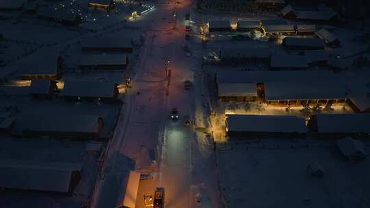 航拍冬季雪后新疆喀纳斯乡村夜景
