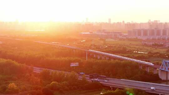 航拍高铁在夕阳下行驶