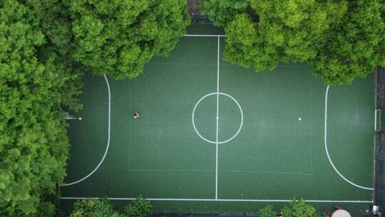 【4K】航拍足球场踢球树木环绕黄昏视频素材模板下载