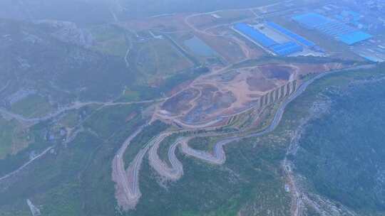 航拍破坏的山体矿石塘坑修复种植植被