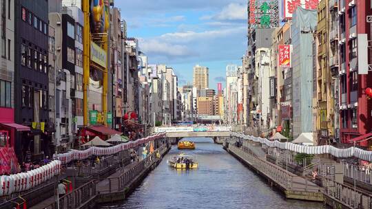 日本大阪市区道顿堀运河两边现代商业建筑视频素材模板下载
