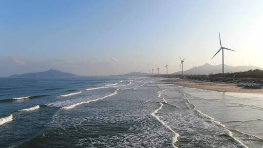 4K航拍海边风车发电新能源风能装置风车实拍