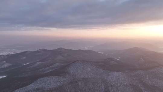 航拍寒冬山区山林雪景暮色