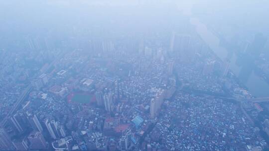 广州天空雨雾与密集城市高楼建筑群航拍