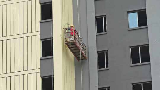 高层建筑外墙工人视频素材模板下载
