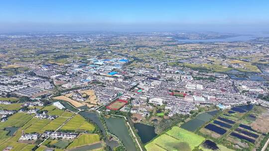 航拍平原农村乡镇水稻田野学校建筑民房河道