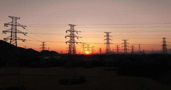 夕阳下电网高压电网铁塔航拍