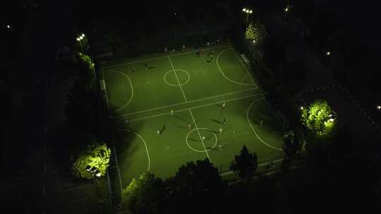 航拍夜晚足球场踢足球比赛视频素材模板下载