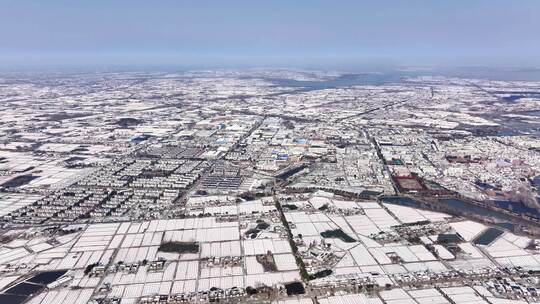 航拍乡镇雪景学校建筑田地大桥别墅河流房屋