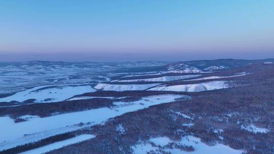 航拍内蒙古额尔古纳雪域山峦暮色