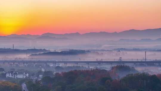 航拍高铁驶过山川与乡村