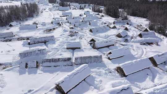 航拍新疆禾木雪景森林雪地小木屋禾木桥雪山