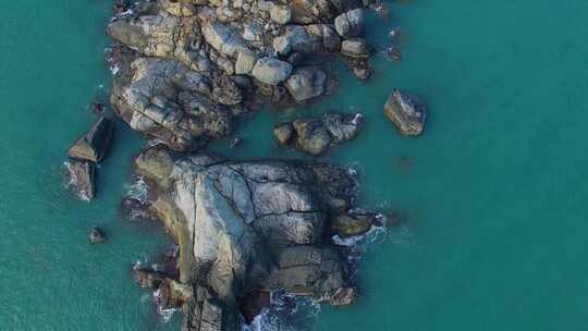 航拍海南三亚西岛海洋文化旅游区海浪礁石