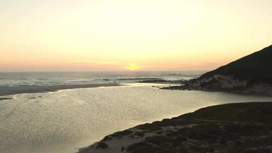 夕阳黄昏海岸沙滩海水波纹