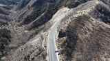 航拍山间蜿蜒公路高清在线视频素材下载