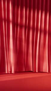 带有光影的红色窗帘飘动
