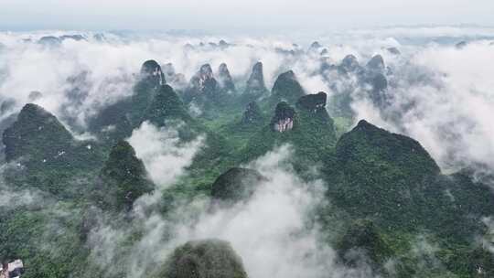 航拍桂林云海下的山峰