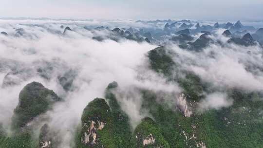 航拍桂林云海下的山峰