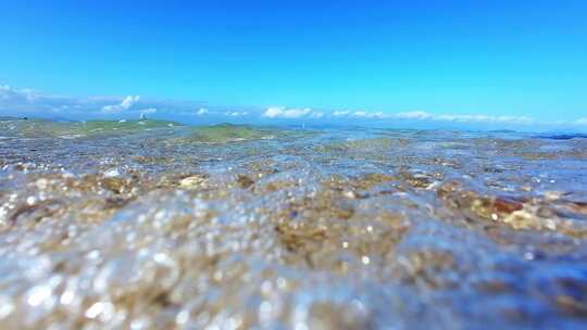 海南三亚海岸线上礁石沙滩海浪微距慢镜