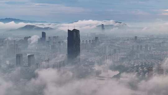 浙江湖州城市地标云雾笼罩下的城市鸟瞰全景