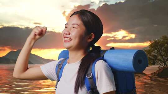 亚洲女性徒步旅行者在湖边庆祝成功的特写侧