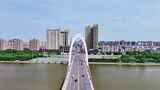 中国吉林梅河口辉发河梅河大桥城市航拍高清在线视频素材下载
