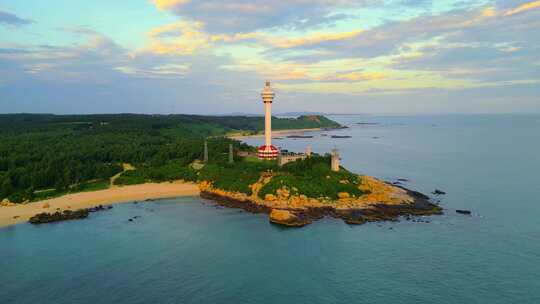 航拍海南省文昌木兰湾航海灯塔日出霞光风景