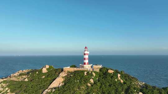 海上灯塔航拍海洋风车发电大海日出阳光海面