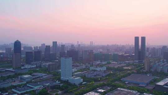 日出晨曦中的杭州滨江城市建筑风景航拍